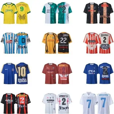 Twelve football jerseys in different club colours arranged in a grid on white